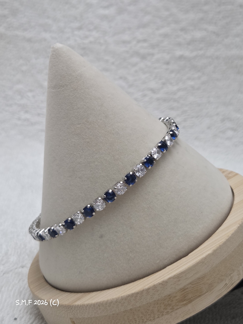 Simulated Blue and White Diamond Tennis Bracelet in Silver tone